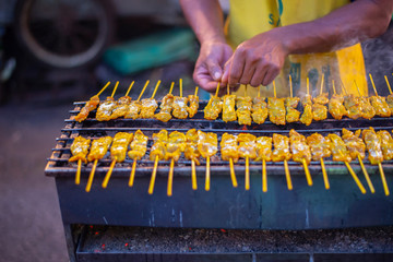 The image of people grilling food