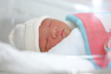 cute little newborn baby sleeping sweet dream in soft blanket