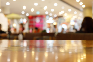 wooden table empty of display in cafe with luxury light decoration