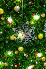 Obraz na płótnie Canvas beautiful snowflake led and light ball decoration on christmas tree ornament