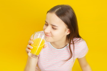 Girl drinks orange juice