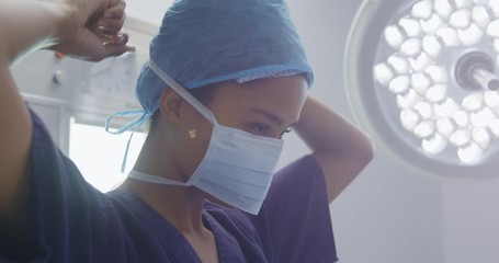 African American woman medical professional working at a hospital - Powered by Adobe