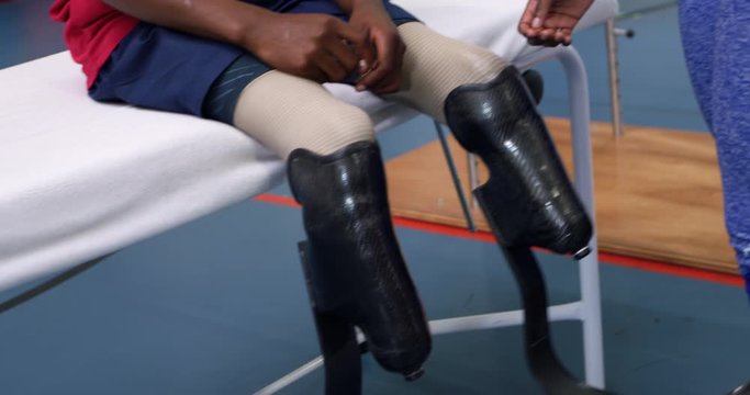 Man exercising with prosthetic legs