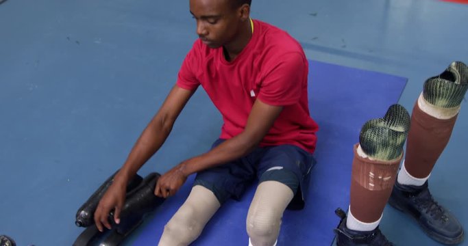 Man exercising with prosthetic legs