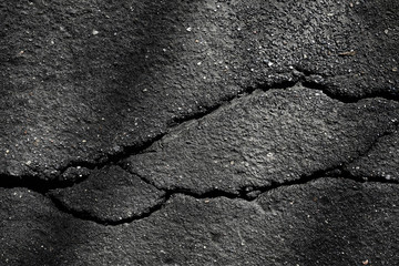 Obraz premium asphalt in cracks texture / abstract background cracks on asphalt road