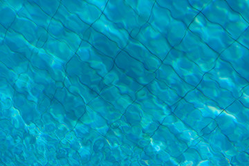 Blue water texture of swimming pool. ummer background. Texture of water surface. Clear Water give soothing effect.