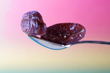 A date is the fruit of a date palm, photographed here in the studio as a detail
