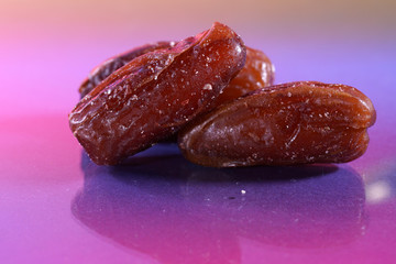 A date is the fruit of a date palm, photographed here in the studio as a detail