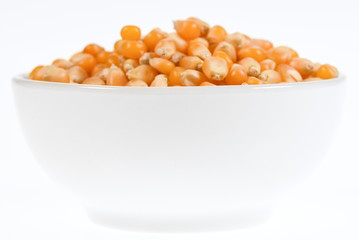 corn in a bowl isolated on white background