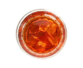 Glass of whiskey with ice cubes isolated on white background, top view