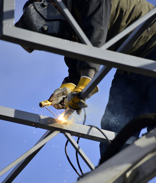 Worker Welding Metal Construction On A Site