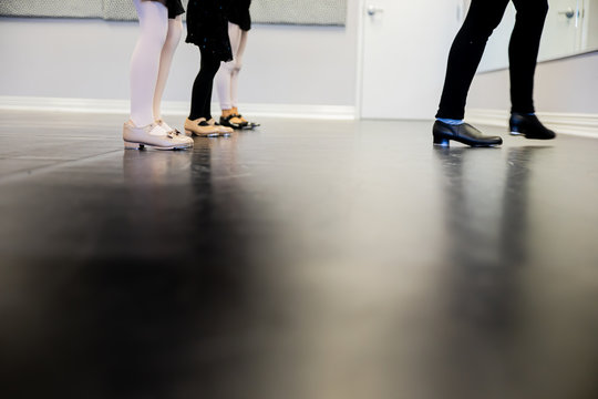 Teacher Showing Young Girls Dance Moves To Students