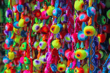 Fototapeta na wymiar Closeup colorful traditional pompom crafts of Peru