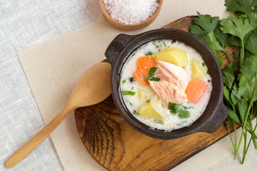 traditional salmon soup with vegetables and cream.