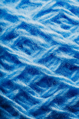 Wool yarn close-up colorful blue threads for needlework.