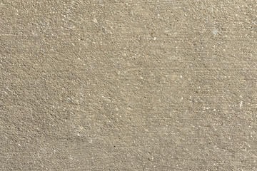 concrete road surface closeup crushed rock stone industry backdrop sandy sidewalk construction...