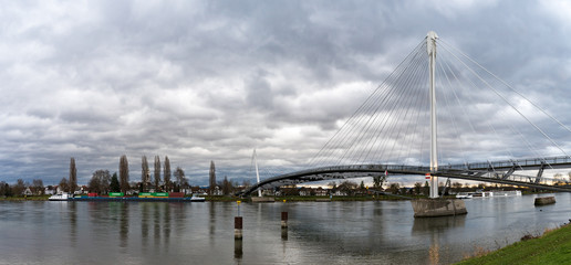 view of the Passerelle des Deux Rives Bridge over the Rhine River outside of Strasbourg
