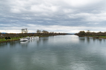 the Rhine river and an anchored river cruise ship near Strasbourg