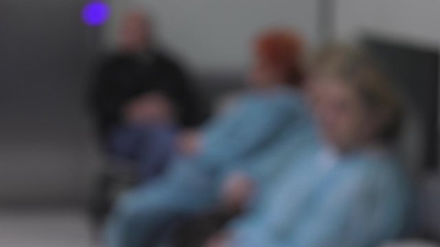 Patients sit in the waiting room. Hospital. Blur.