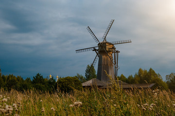 Fototapeta premium Old wooden windmill in the autmn field