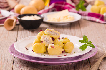 Potato gnocchi stuffed with radicchio and ricotta.