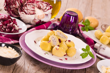 Potato gnocchi stuffed with radicchio and ricotta.