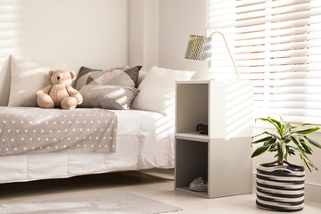 Modern child room interior with comfortable bed