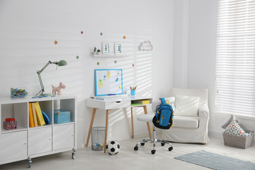 Modern child room interior with stylish furniture