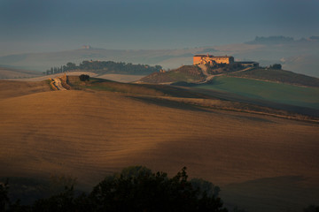 Tuscany hills at sunset, autumn in the famous region of Italy. A true classic Tuscan landscape.