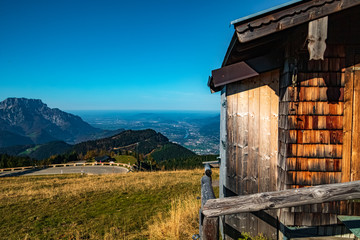 Beautiful alpine autumn or indian summer view with details of a wooden hut at the famous...