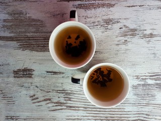  close-up of abstract tea cups on a wooden surface