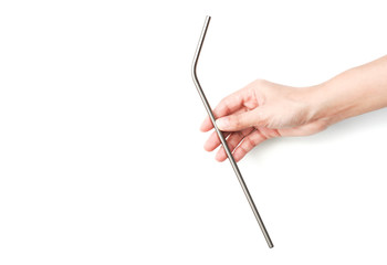 Straw steel silver in the hand on a white background, stop the plastic straw and secure environment concept