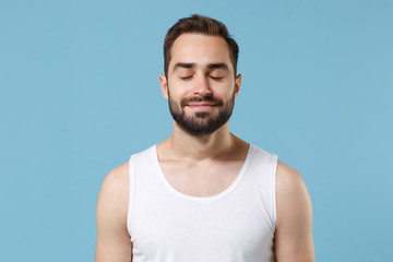 Close up bearded young man 20s years old perfect skin wearing white shirt isolated on blue pastel...