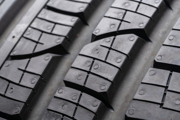 road tread protector all-season summer tire. close up. the tread blocks and sipes for evacuating...
