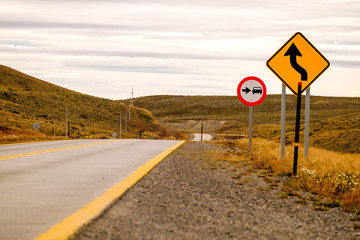 A road sign shows a coming turn on 'Ruta 9' between Punta Arenas and Puerto Natales. It is an ideal start for a road trip in the endless landscapes of Patagonia.