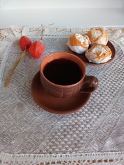 cup of tea and cookies on wooden background