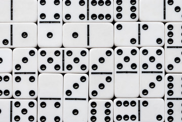 Background of dominoes. Board game. Hobbies collecting dominoes