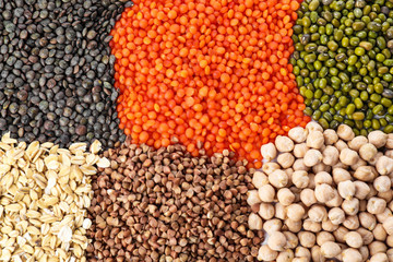 Different grains and cereals as background, top view