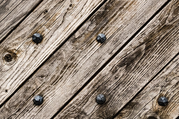 Aged wood surface with steel nails texture background wallpaper