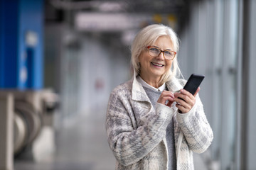 Portrait of senior woman using mobile phone