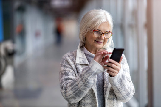 Portrait of senior woman using mobile phone