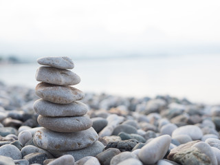 Pyramid of smooth stones on the beach