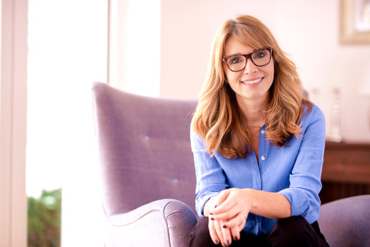 Cheerful Middle Aged Woman Indoor Portrait