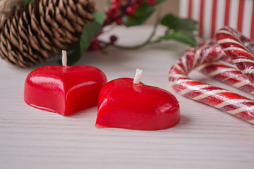 Two red candles and Christmas ornaments.Christmas still life concept.