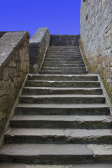 Fototapeta na wymiar Stone stair in the ancient castle vertical