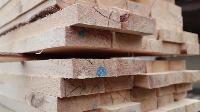 Stack of wooden bars. Slow motion 