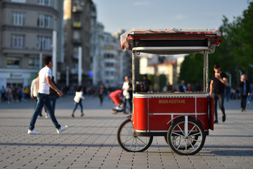 Turkish traditional street food cart on wheels. Text on cart in translating from Turkish language to English is Corn and chestnut. © Oleksandr