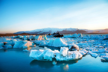 Magical beautiful landscape with ice depths in the famous Jokulsarlon glacial lagoon in Iceland at sunny day. Exotic countries. Amazing places. Popular tourist atraction. (global warming – concept)