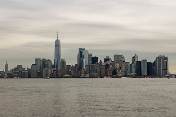 Fototapeta na wymiar Manhatten, New York City skyline with Hudson river and grey skies