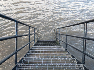 Perspective of steps down to the Thames River